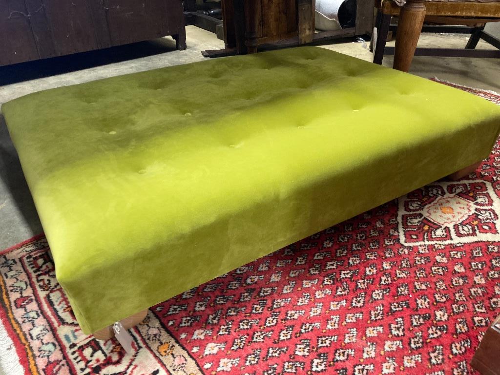 A contemporary Omega Italian velvet footstool, length 124cm, depth 88cm, height 24cm